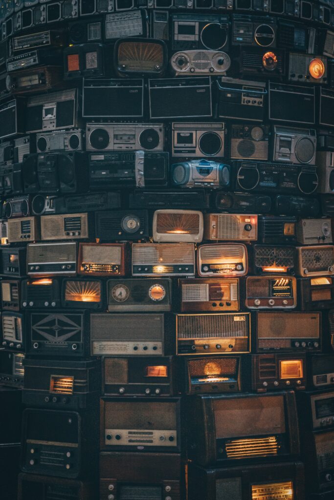 old radios stacked on each other