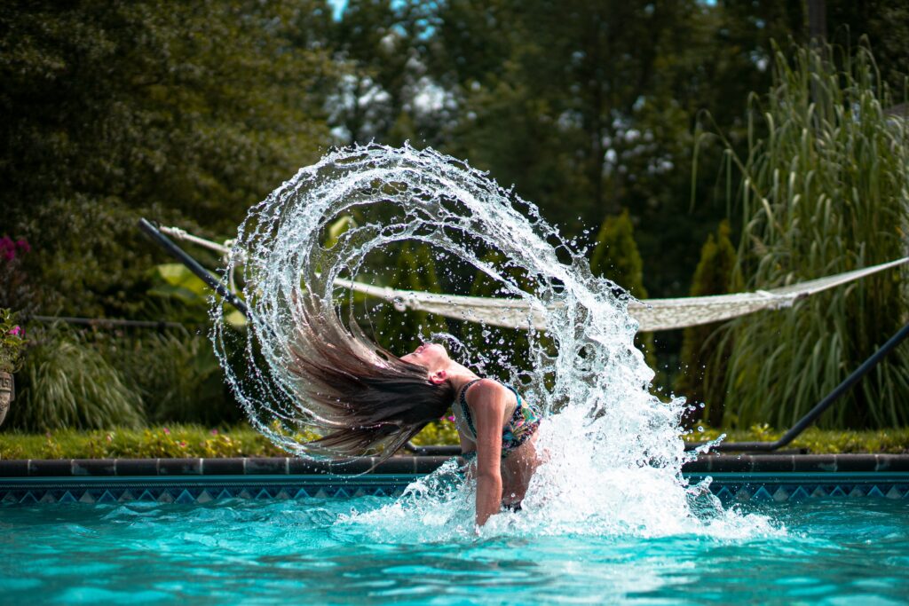 girl splashing out of water