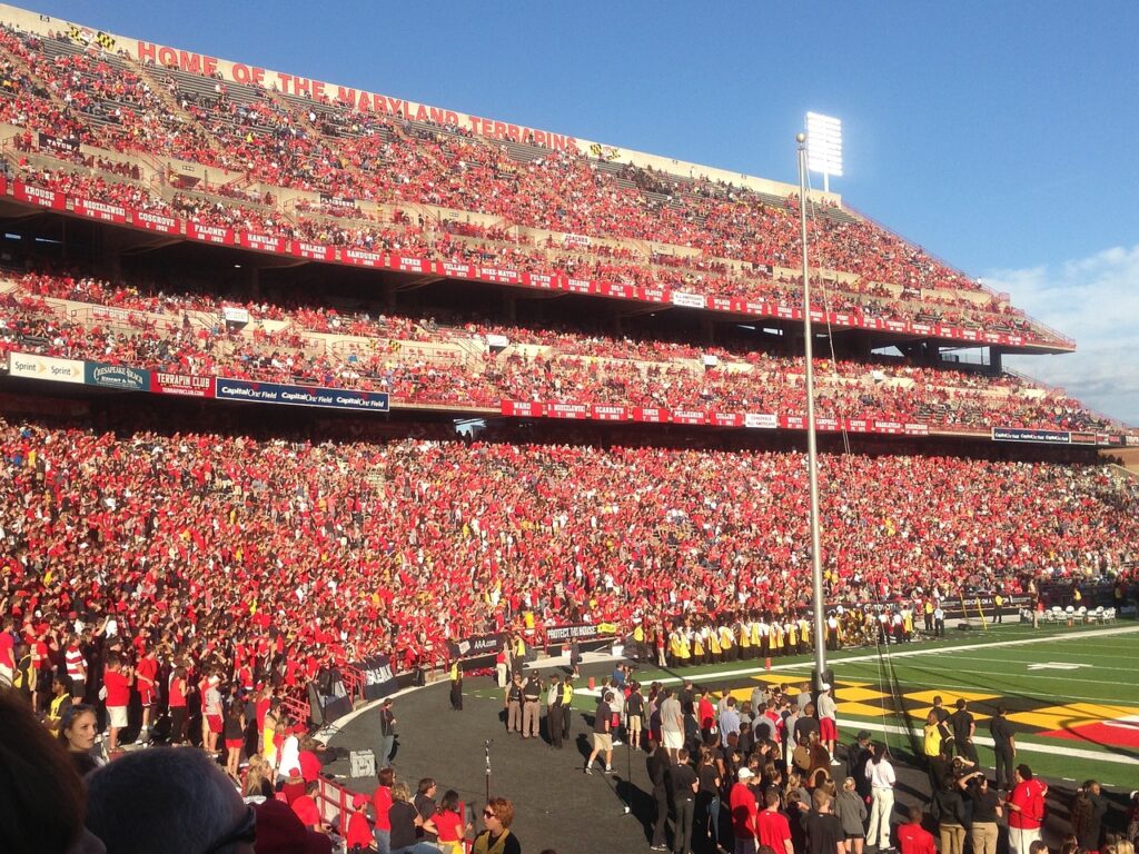 college football fans pack the stands
