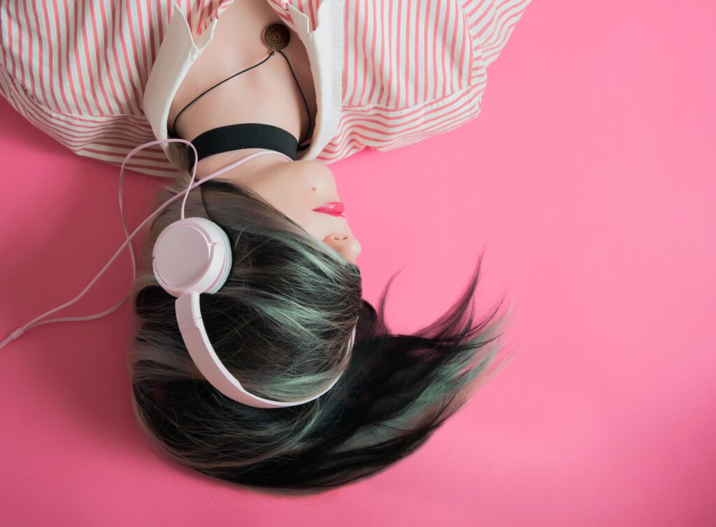 upside down girl listening to headphones