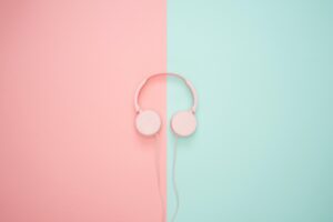 pink headphones with pink and blue background