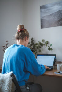 Woman working on her laptop at home