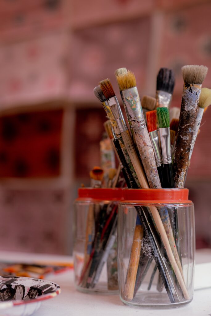 paint brushes in a cup