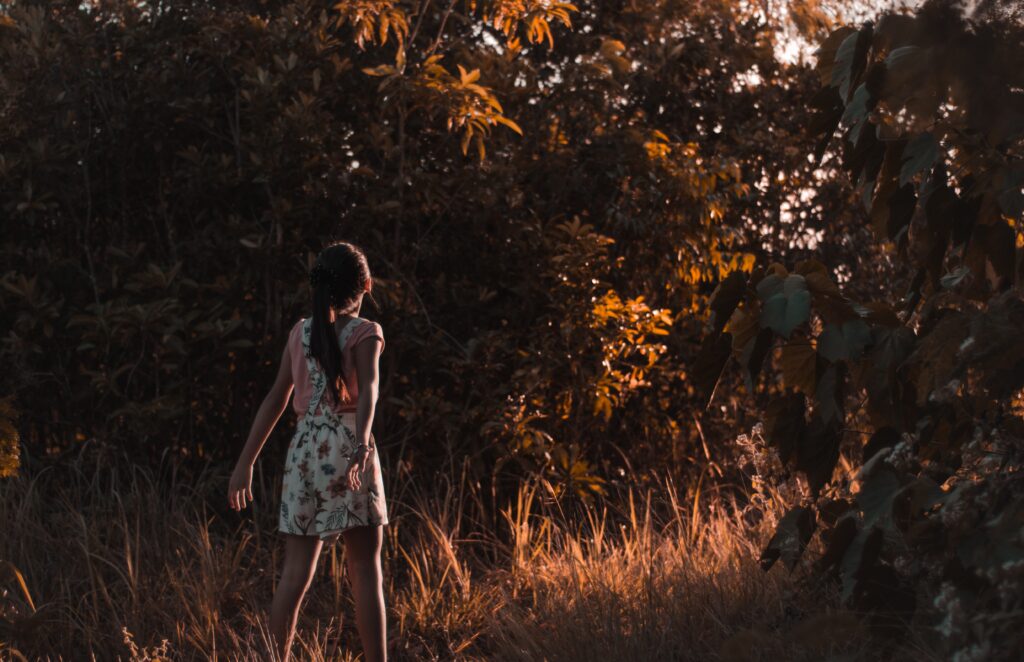 girl looking at trees